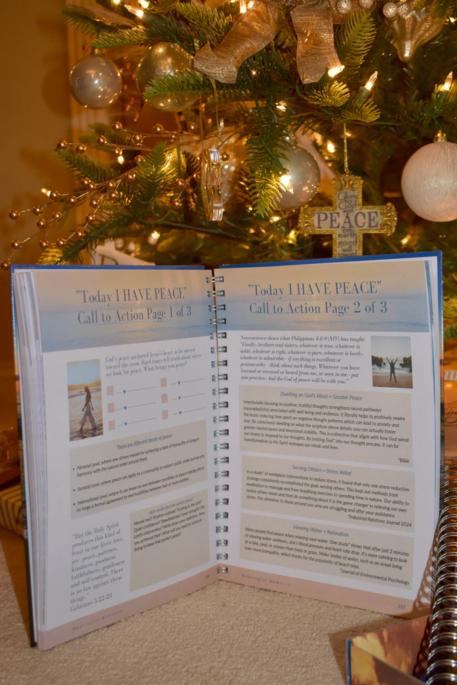 Open book titled 'Today I Have Peace' in front of a decorated Christmas tree.