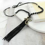 Black Suede Tassel and Wood Bead Cross Necklace