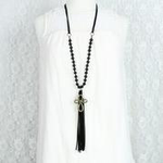 stylewithmeaning.com 17.00 NPALP02.10 Black Suede Tassel and Wood Bead Cross Necklace
